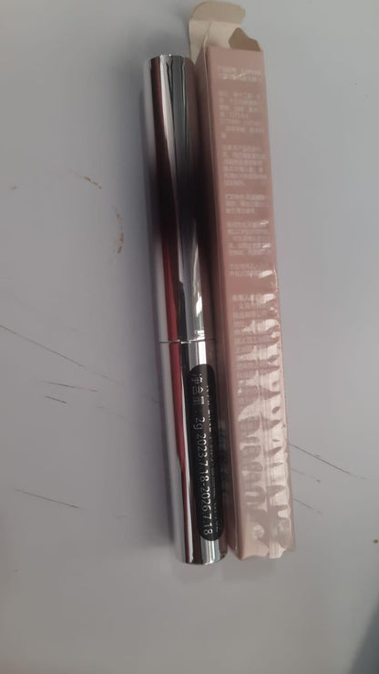 19378 Iron Brush Mascara eye serum applicator with a sleek design, showing the brush and serum inside for enhancing eyelashes.