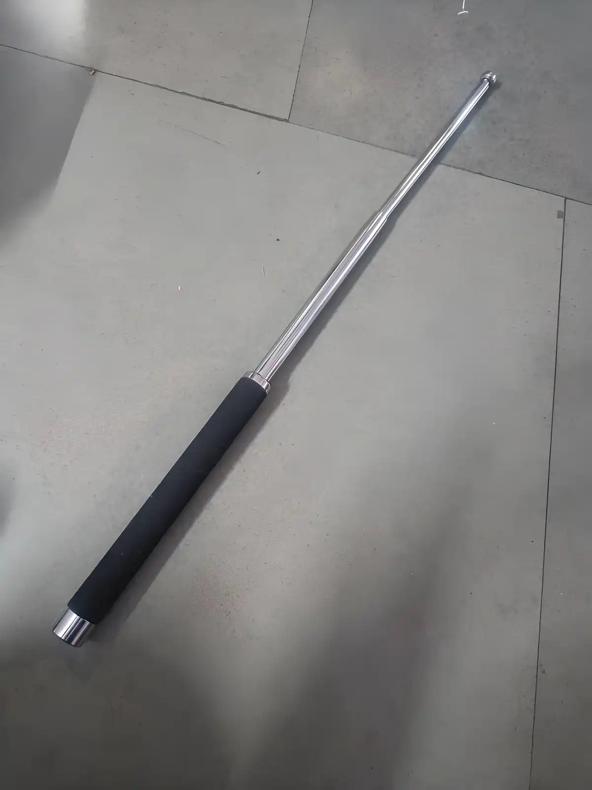 Extendable telescopic self-defense stick and hand pointer resembling hockey sticks, retractable and portable for personal safety.