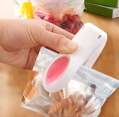 Two handheld plastic mini heat sealing machines from 19378, kitchen tool set for sealing plastic bags and packaging.