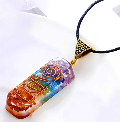 Titanium quartz stone pendant used for pooja, featuring a polished, vibrant gemstone set in a decorative design.