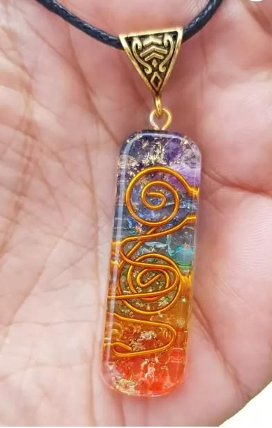 Titanium quartz stone pendant for pooja articles, showcasing a polished, natural stone with intricate design details.