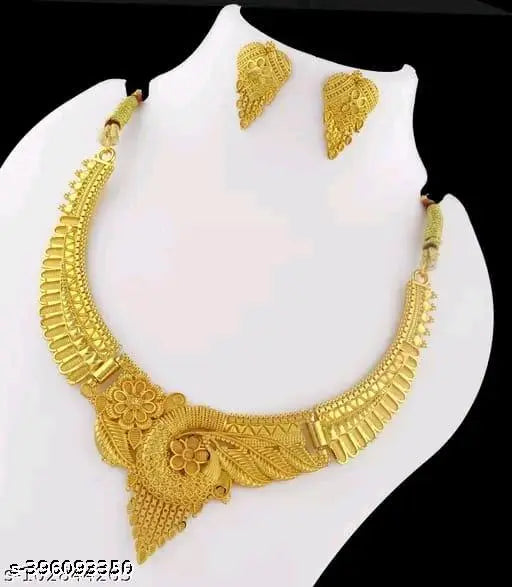Gold women's jewelry set featuring intricate designs, including earrings and necklace, from the New Tready Golden Jewellery collection.