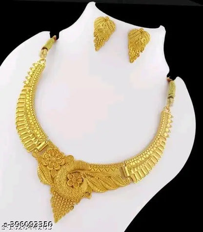Gold women's jewelry set featuring intricate designs, including earrings and necklace, from the New Tready Golden Jewellery collection.