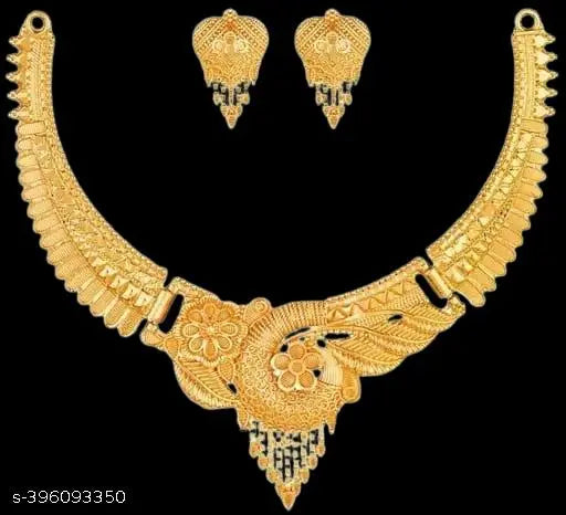 Gold women's jewellery set featuring intricate designs, including earrings and necklace, from the New Tready collection.