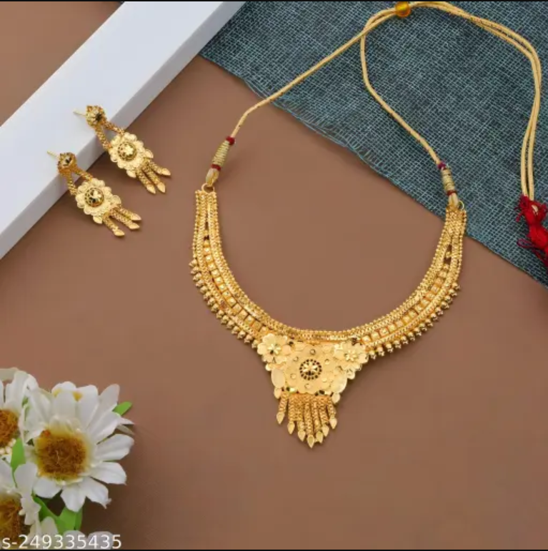Gold-plated women's jewellery set with matching necklace and earrings, featuring a grand look and elegant design.