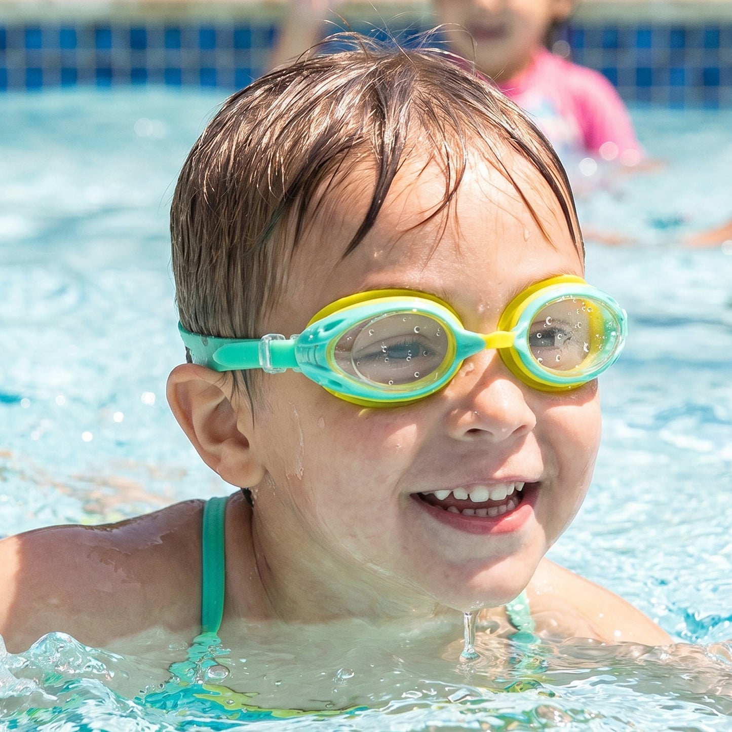Kids Wukusy dual color swimming goggles with clear vision lens, comfortable fit, suitable for children’s swimming and water activities.