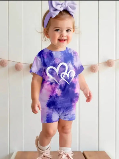 Kids tie-dye heart print summer set with purple and pink t-shirt and shorts by ekom, perfect for warm weather.