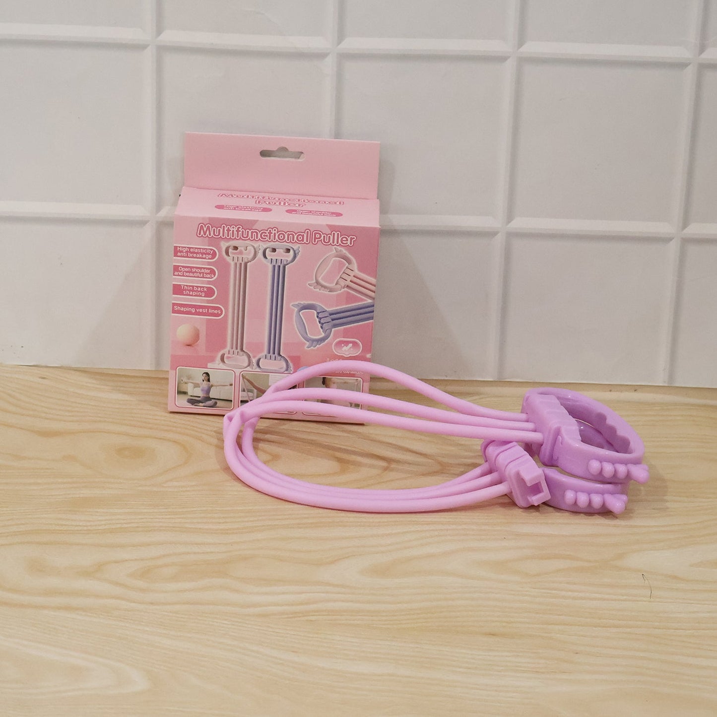 Wukusy multifunctional chest expander puller with three resistance tubes for home gym workouts, shown in use with handles and bands.