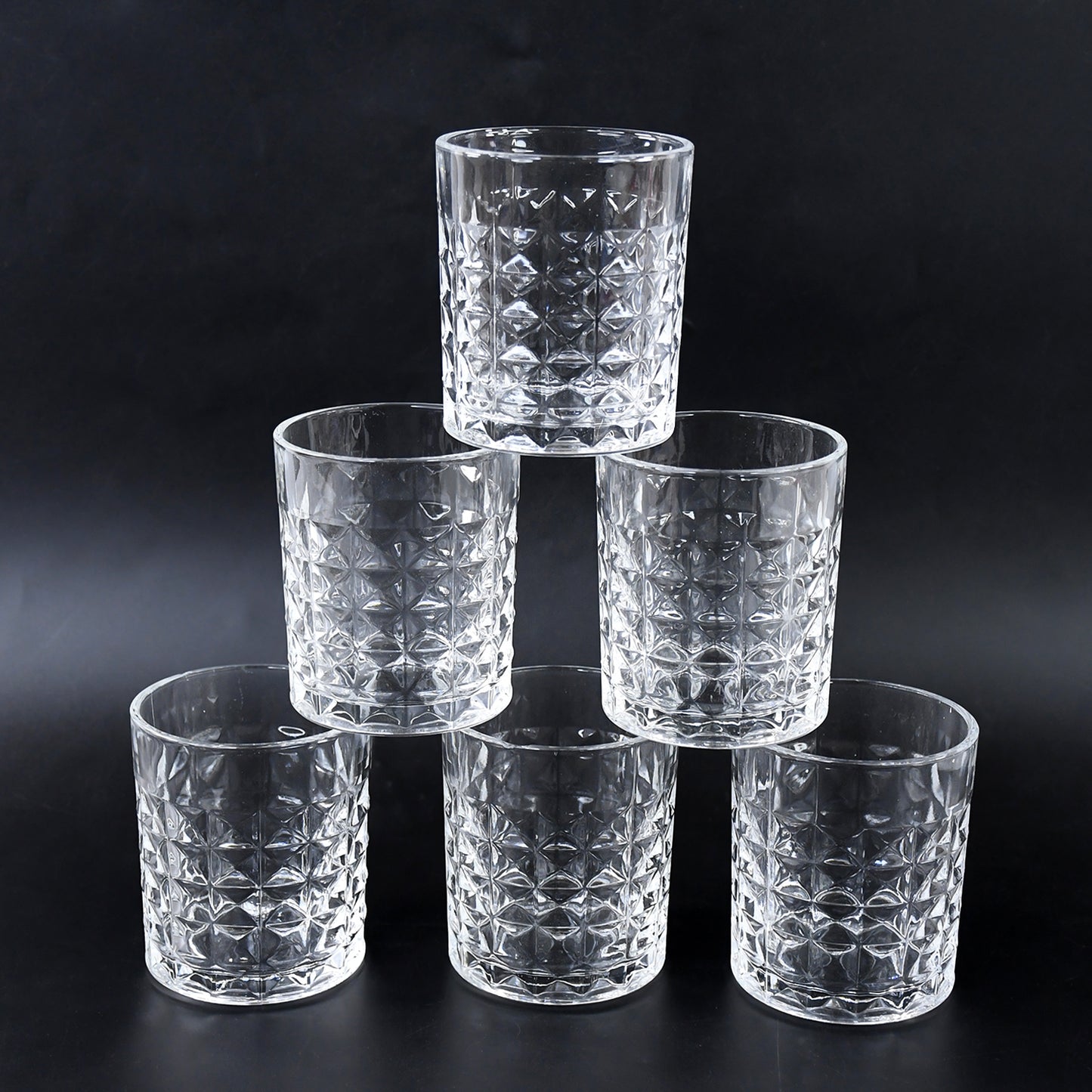 Six crystal-style glass tumblers with 210 ml capacity from Wukusy, arranged on a wooden surface.