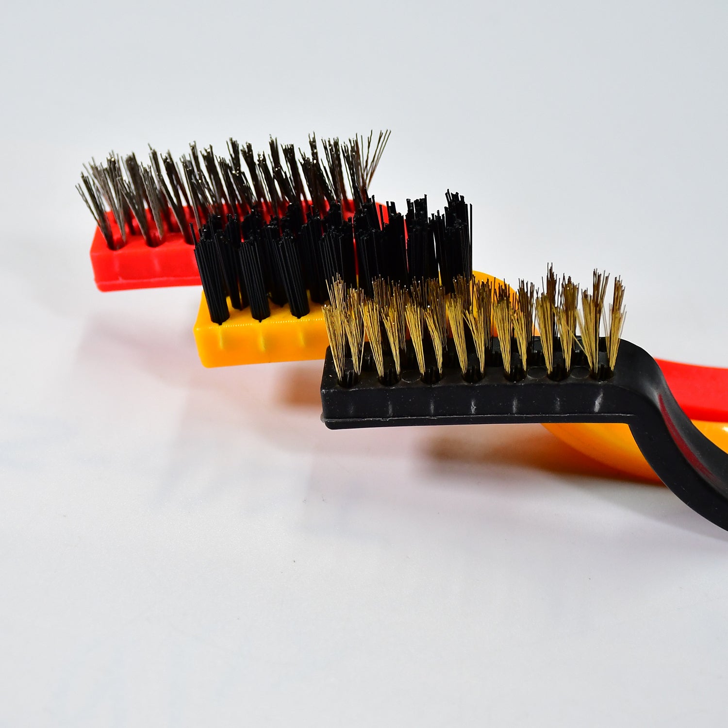 Wukusy 2166 3-piece mini wire brush set with brass, nylon, and stainless steel bristles for cleaning gas stoves, tiles, and rust removal.