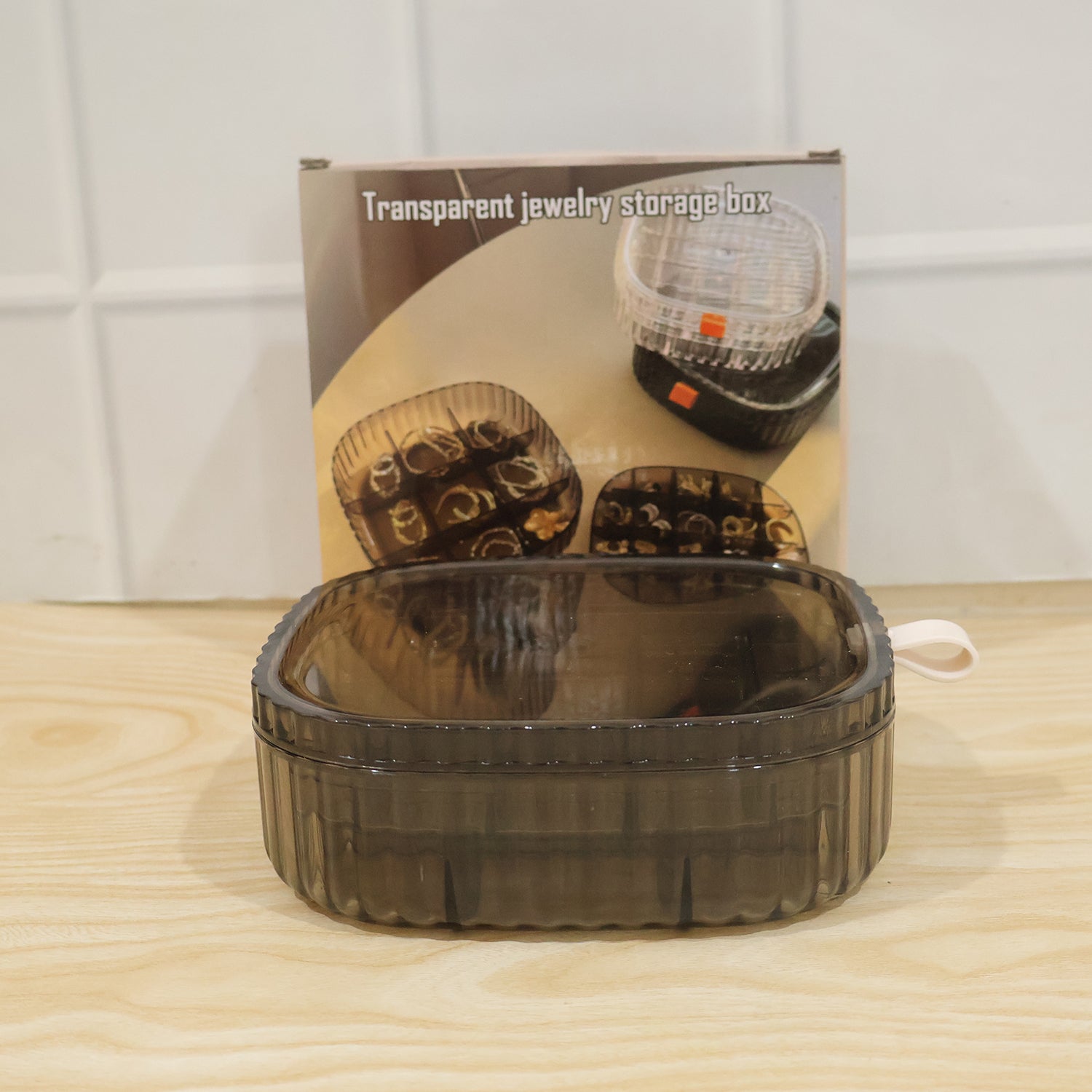 Stackable Wukusy plastic jewelry organizer box with multiple compartments for rings and small accessories, shown stacked in the image.