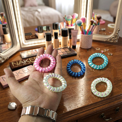 Set of five soft stretchable telephone wire style hair bands in assorted colors by Wukusy, ideal for gentle hair styling.