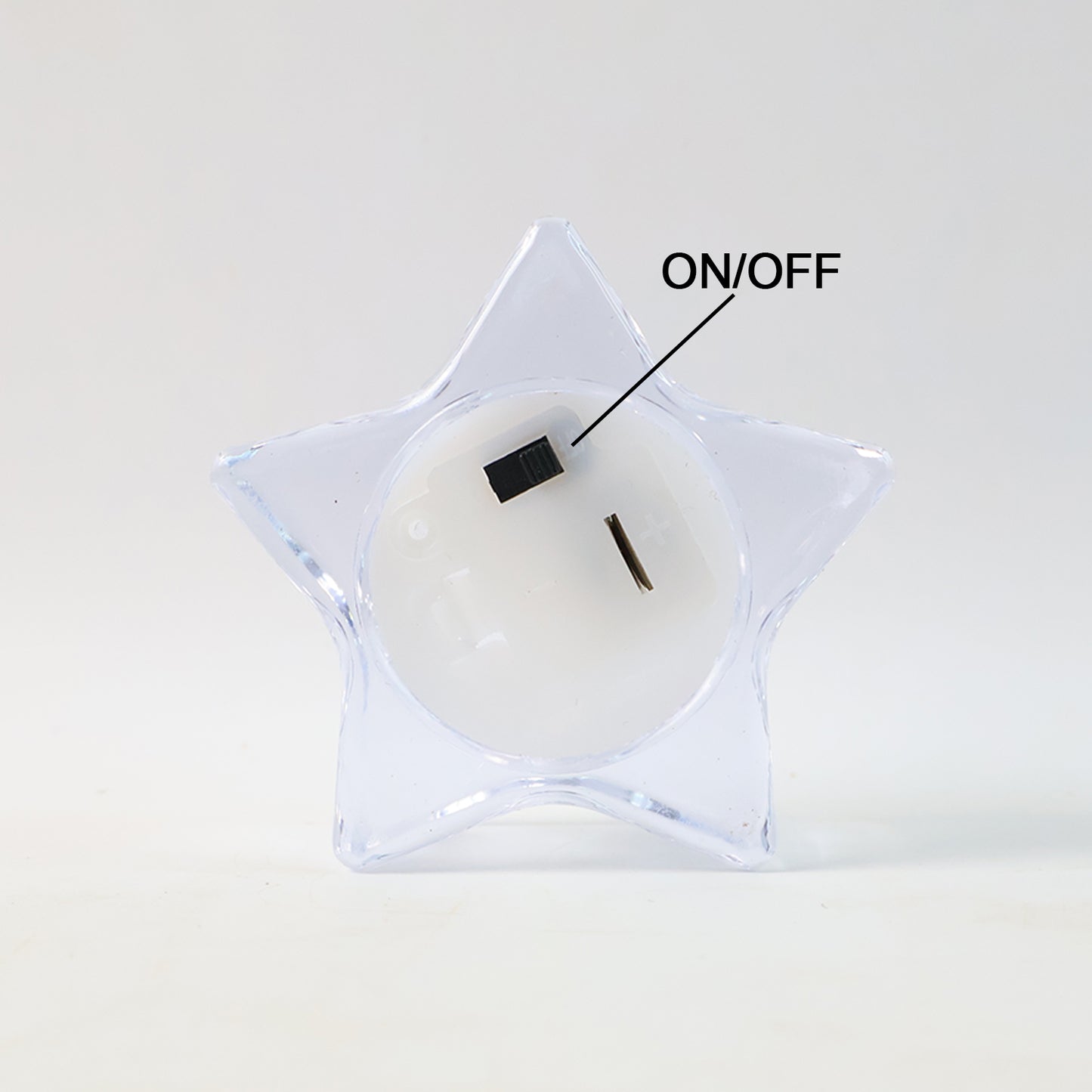 Set of four Wukusy flameless star-shaped LED candles for home decor, glowing with warm, flickering light.