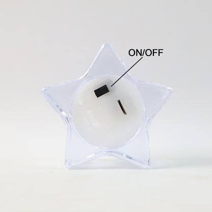 Set of four Wukusy flameless star-shaped LED candles for home decor, glowing with warm, flickering light.