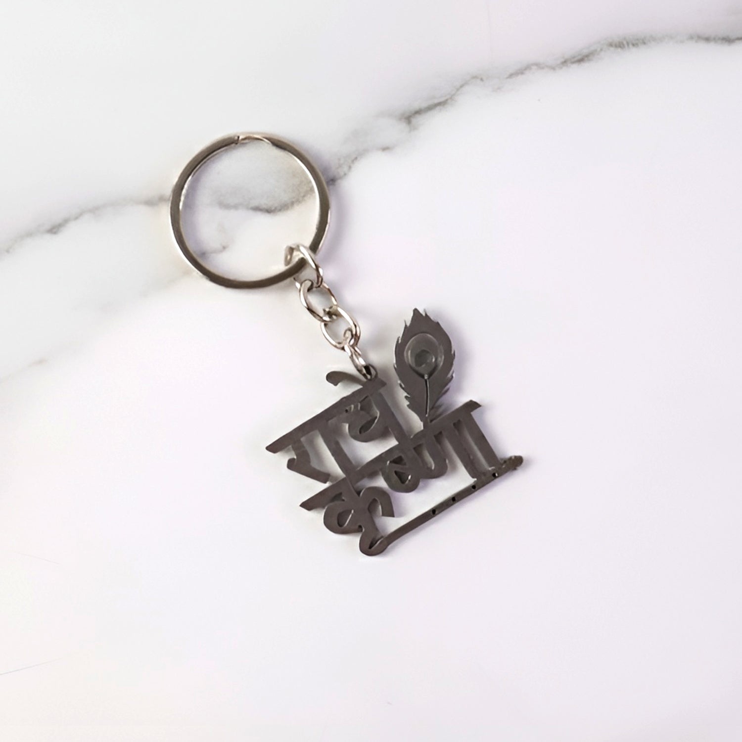 Premium Radhe Krishna metal keychain by Wukusy featuring intricate Krishna deity design on a durable metal keyring.