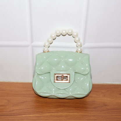 Wukusy elegant quilted mini handheld sling handbag with stylish design, compact size, and fashionable appearance.