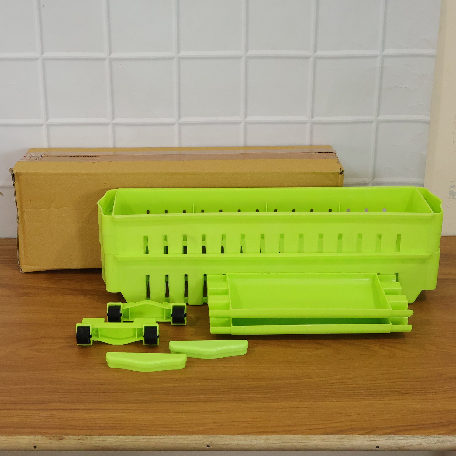 Wukusy Prexo plastic 2-layer slim storage rack with wheels, featuring a compact design and sturdy construction for organized space.