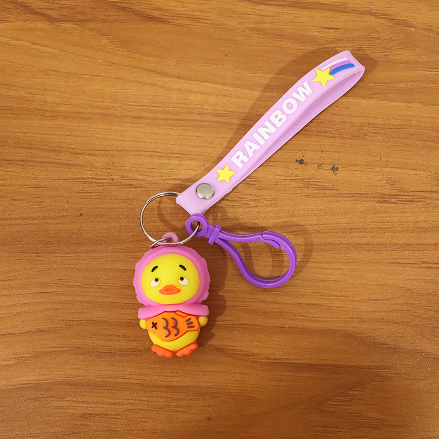 Cute cartoon duck keychain by Wukusy featuring a colorful, plush duck design with a metal keyring for easy attachment.