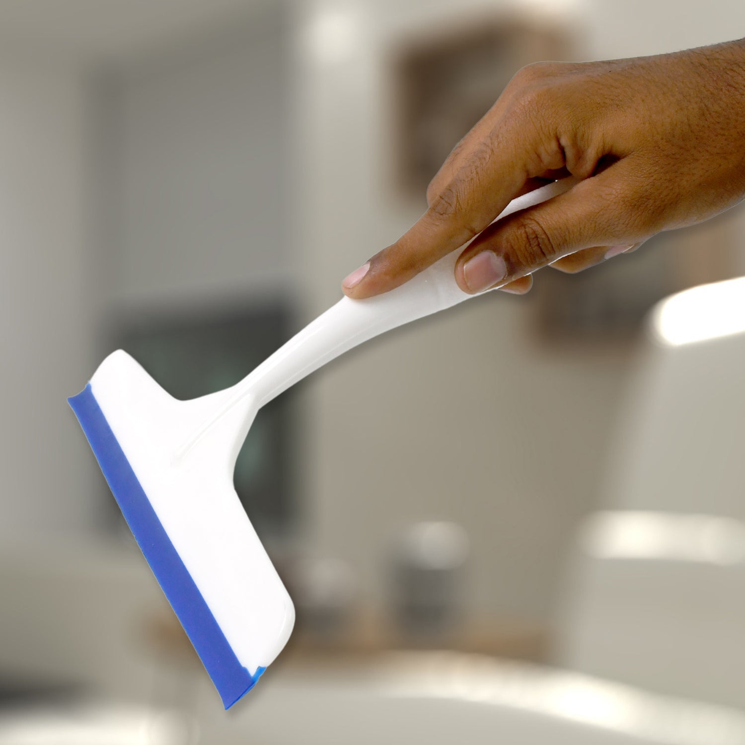 White plastic kitchen wiper by Wukusy, single-piece cleaning tool with a sturdy handle for wiping surfaces.