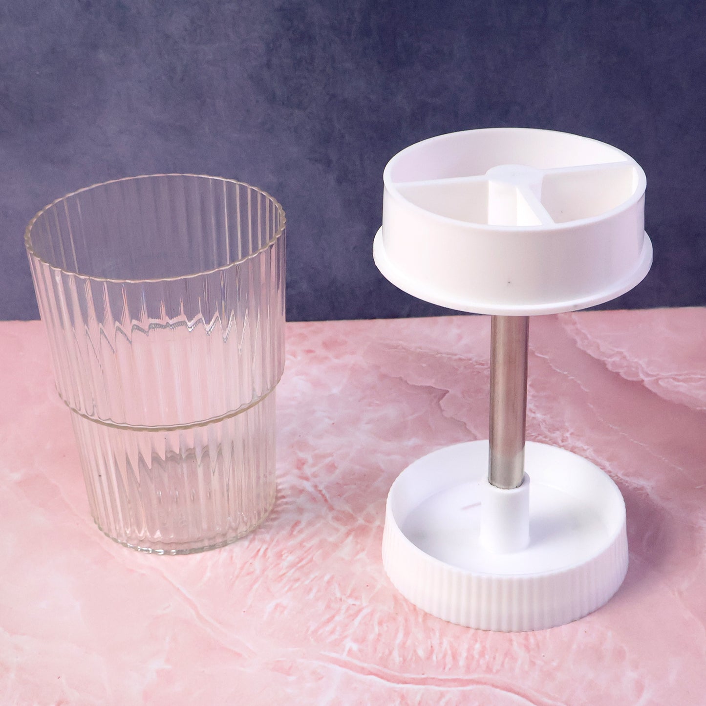 Wukusy rotating bathroom toothbrush holder stand with multiple slots for toothbrushes and toothpaste, made of durable plastic.