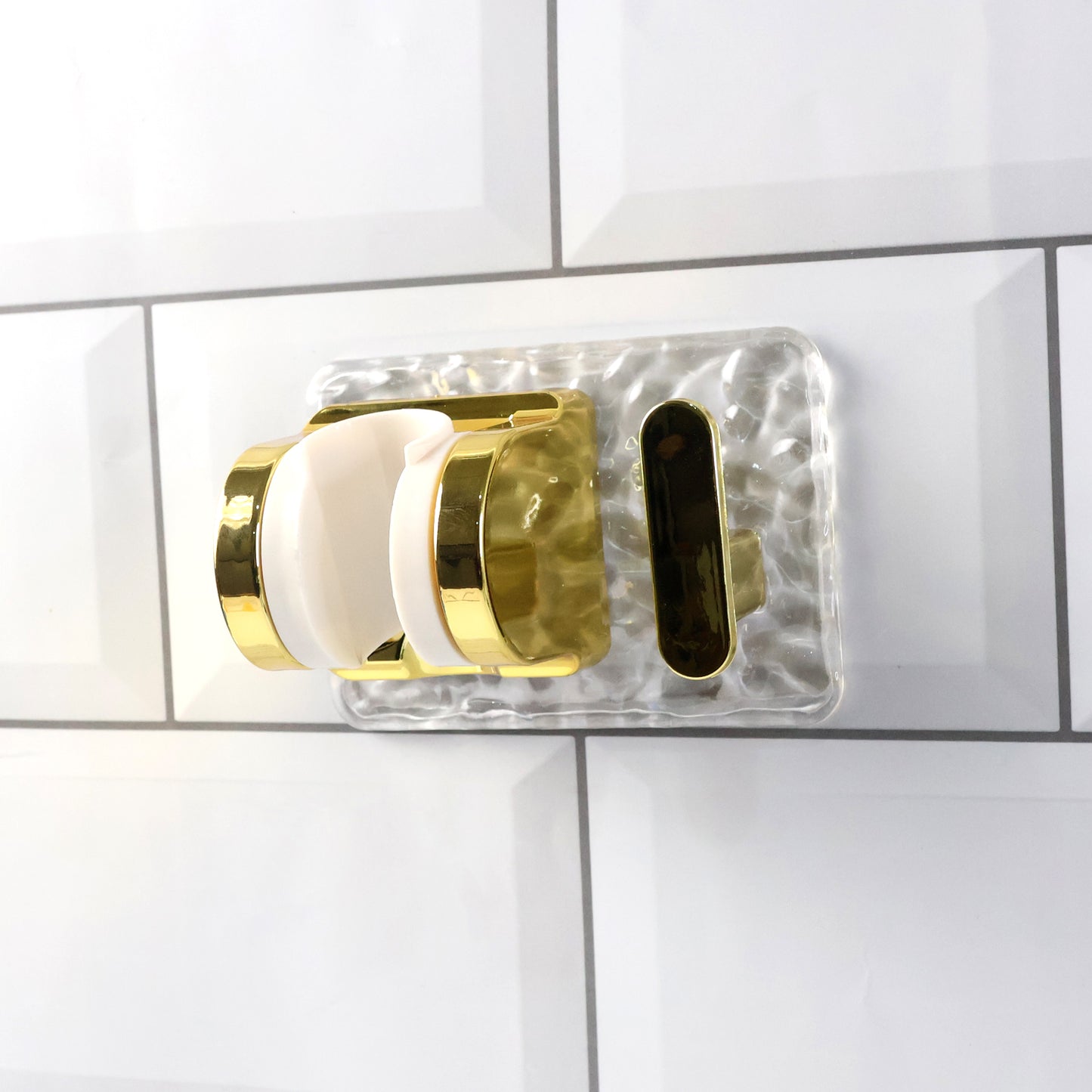 Wall mounted broom and mop holder by Wukusy with strong grip clips for secure storage of cleaning tools.