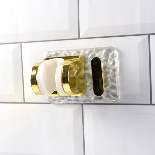 Wall mounted broom and mop holder by Wukusy with strong grip clips for secure storage of cleaning tools.