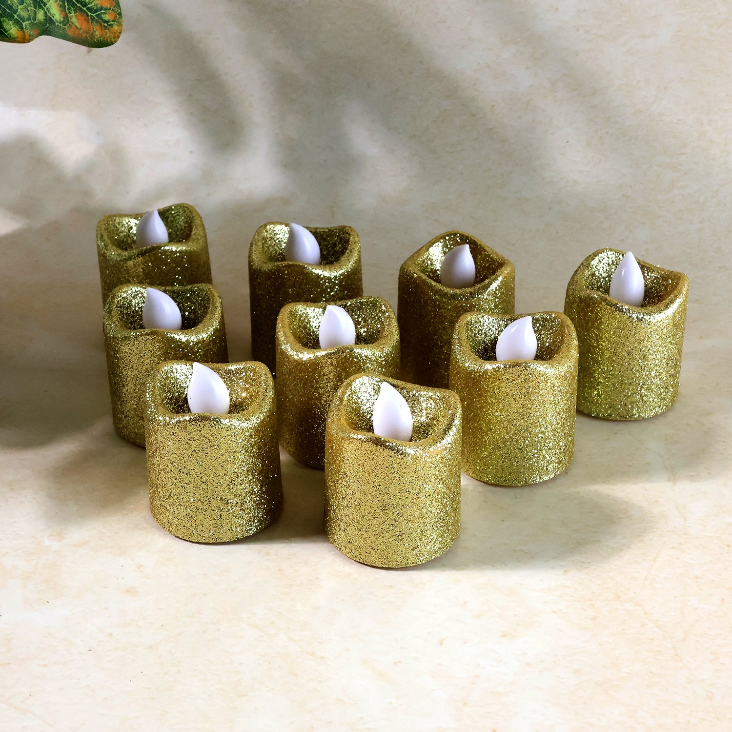 Set of 9 Wukusy Christmas premium glitter LED tealight candles for holiday home decor, featuring festive glitter and warm LED light.