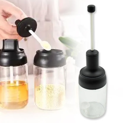Wukusy heat-resistant glass condiment container with airtight cap, includes serving spoon, used for salt, spices, honey, and sugar.