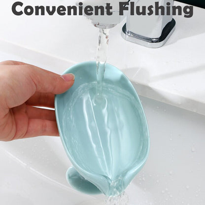 Wukusy leaf-shaped self-draining soap holder for bathroom and kitchen, soap dish with drainage design on a countertop.