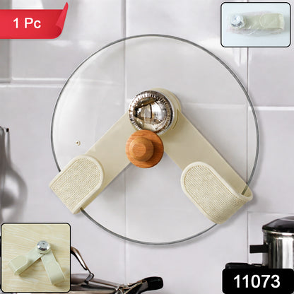 Wukusy adjustable kitchen pot lid holder clip holding a pot lid on a countertop in a modern kitchen setting