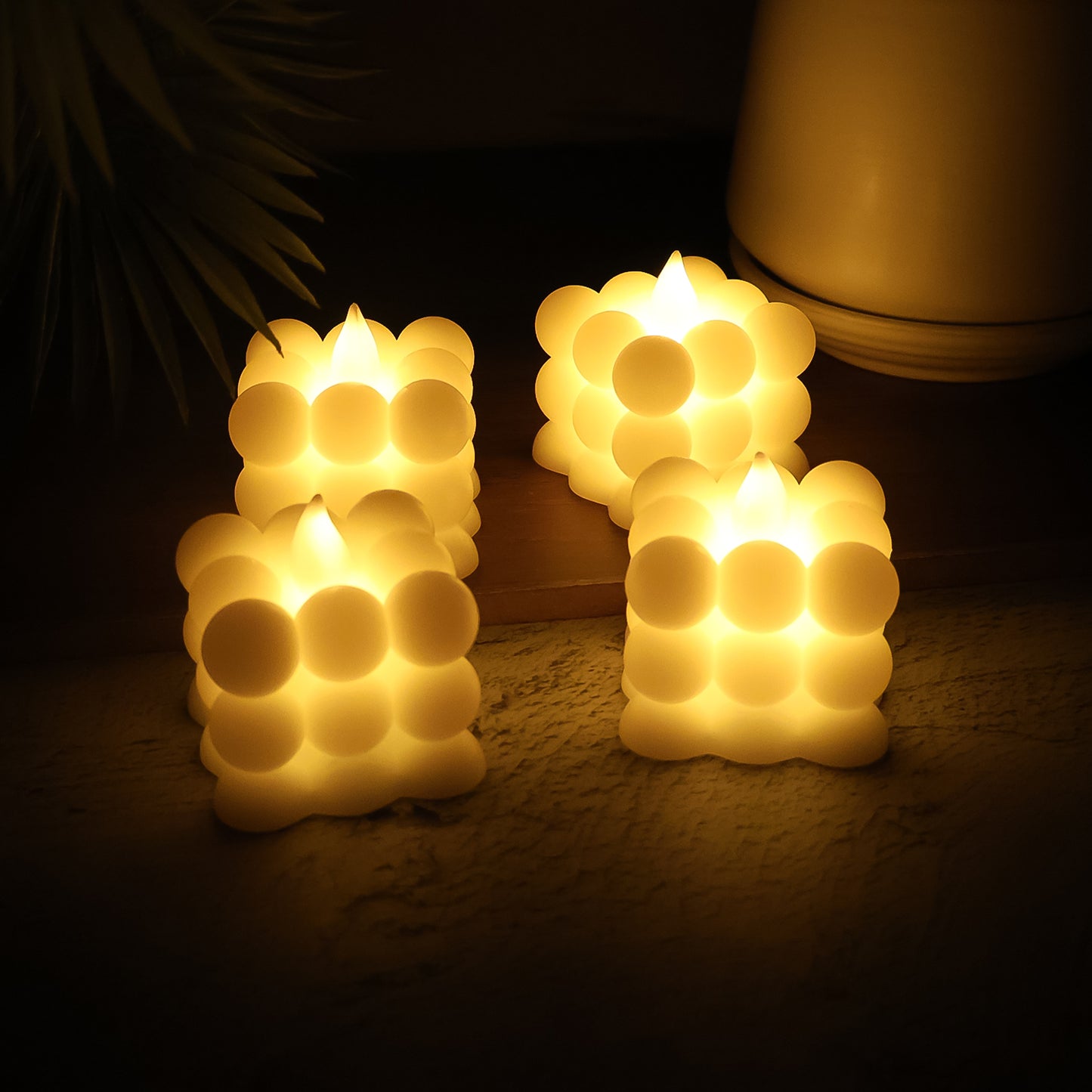 Set of 24 Wukusy LED flameless cube decorative candles for home decor, featuring warm, flickering light effects.