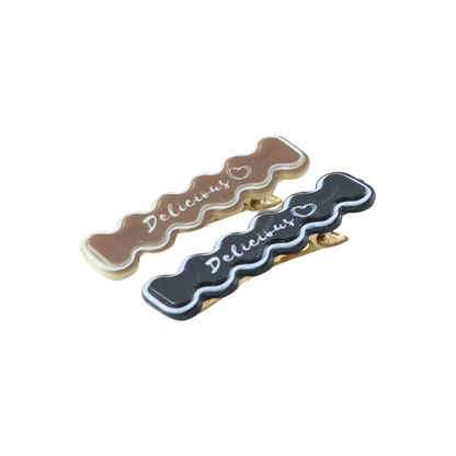 Set of four elegant design hair clips by Wukusy featuring sleek, stylish accessories for hair styling and decoration.