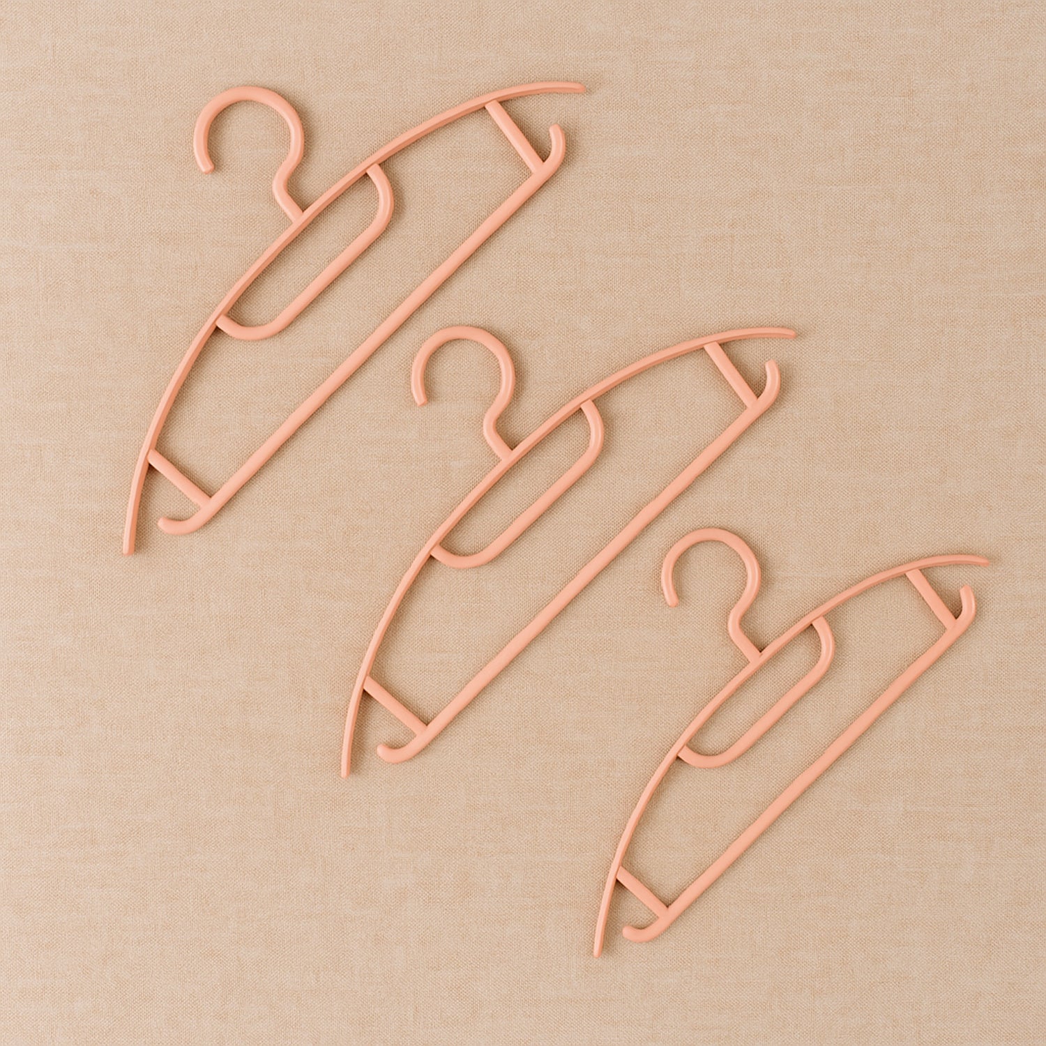 Set of six durable plastic Ganesh-themed cloth hangers by Wukusy for home organization and clothing hanging.