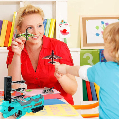 Wukusy 4710 airplane launcher gun toy with foam glider planes for outdoor kids' air battle game, includes five foam planes.