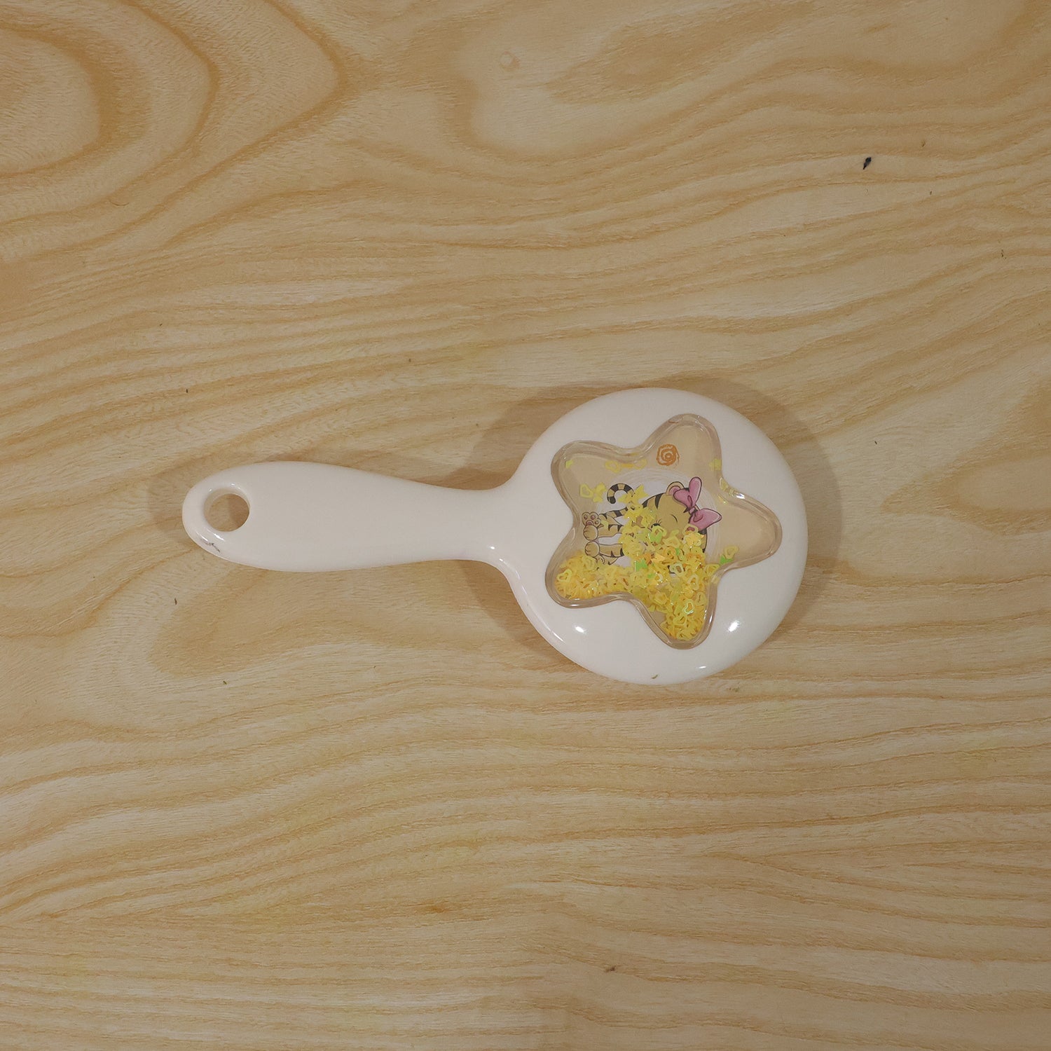 Wukusy cute star design kids hair brush with soft bristles for gentle detangling, shown in a child's hand.