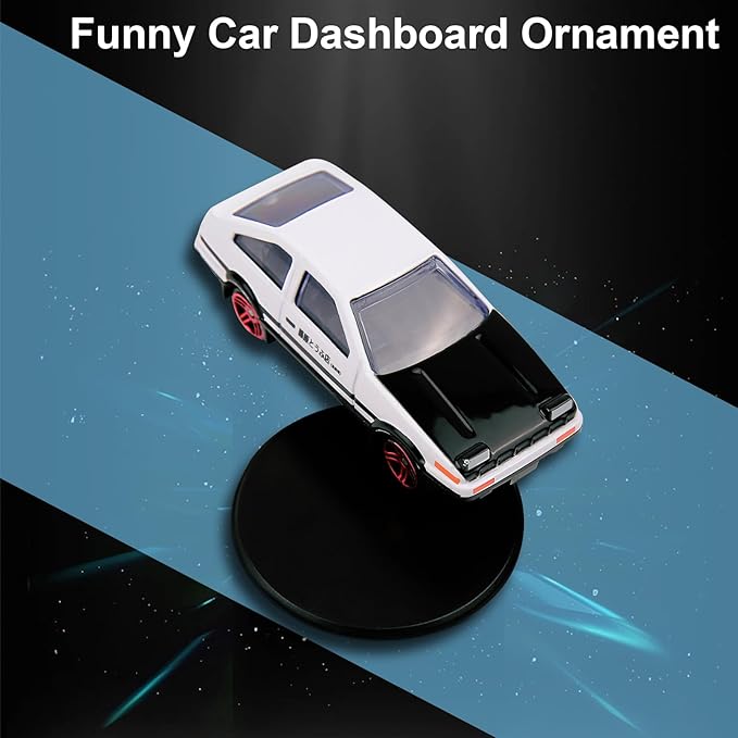 Car dashboard spinner figurine of an AE86 model, branded 22123, shown on a vehicle dashboard in a close-up view.