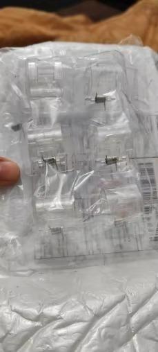 Set of 10 22123 wall hooks with self-adhesive rods clips for hanging lightweight items, shown attached to a wall surface.