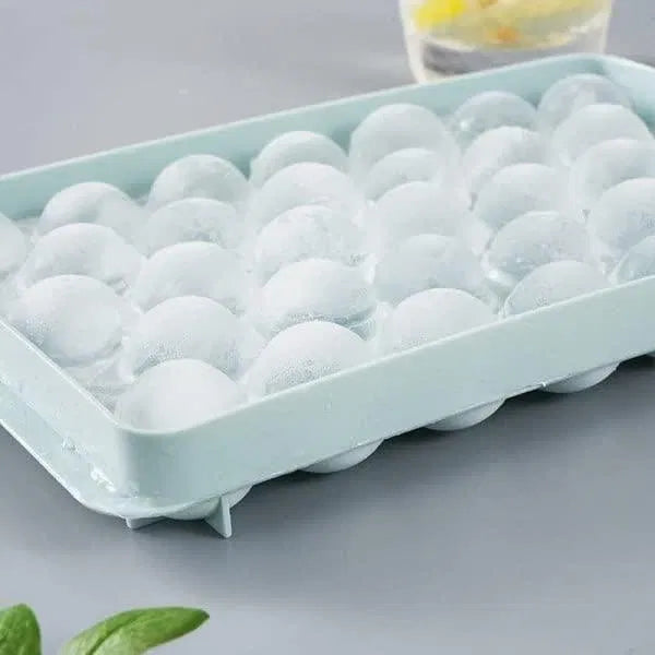 Reusable plastic flexible round ice cube tray by 22927, showing multiple ice cubes in a clear tray for easy freezing.