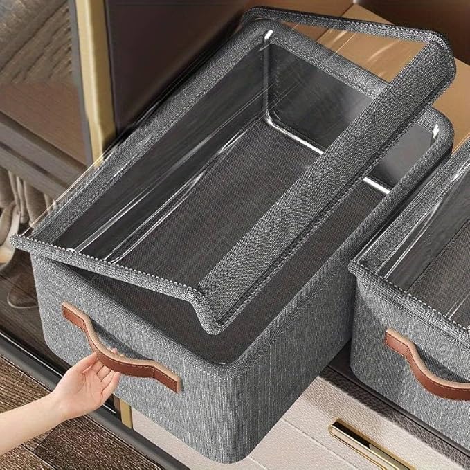 Large clear fabric folding storage boxes with lids, stackable closet organizers and label tags for home makeup vanity storage.