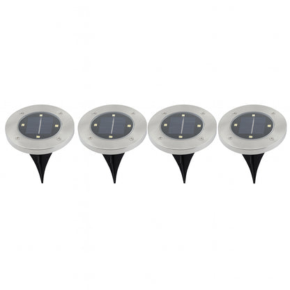 Set of four Wukusy solar powered LED garden lights illuminating a garden pathway with modern design.
