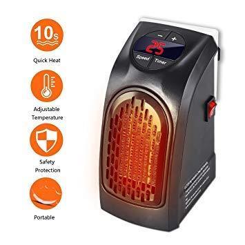 Wukusy 251 electric mini handy heater plugged into wall outlet, compact 400W electronic space heater for quick warmth.