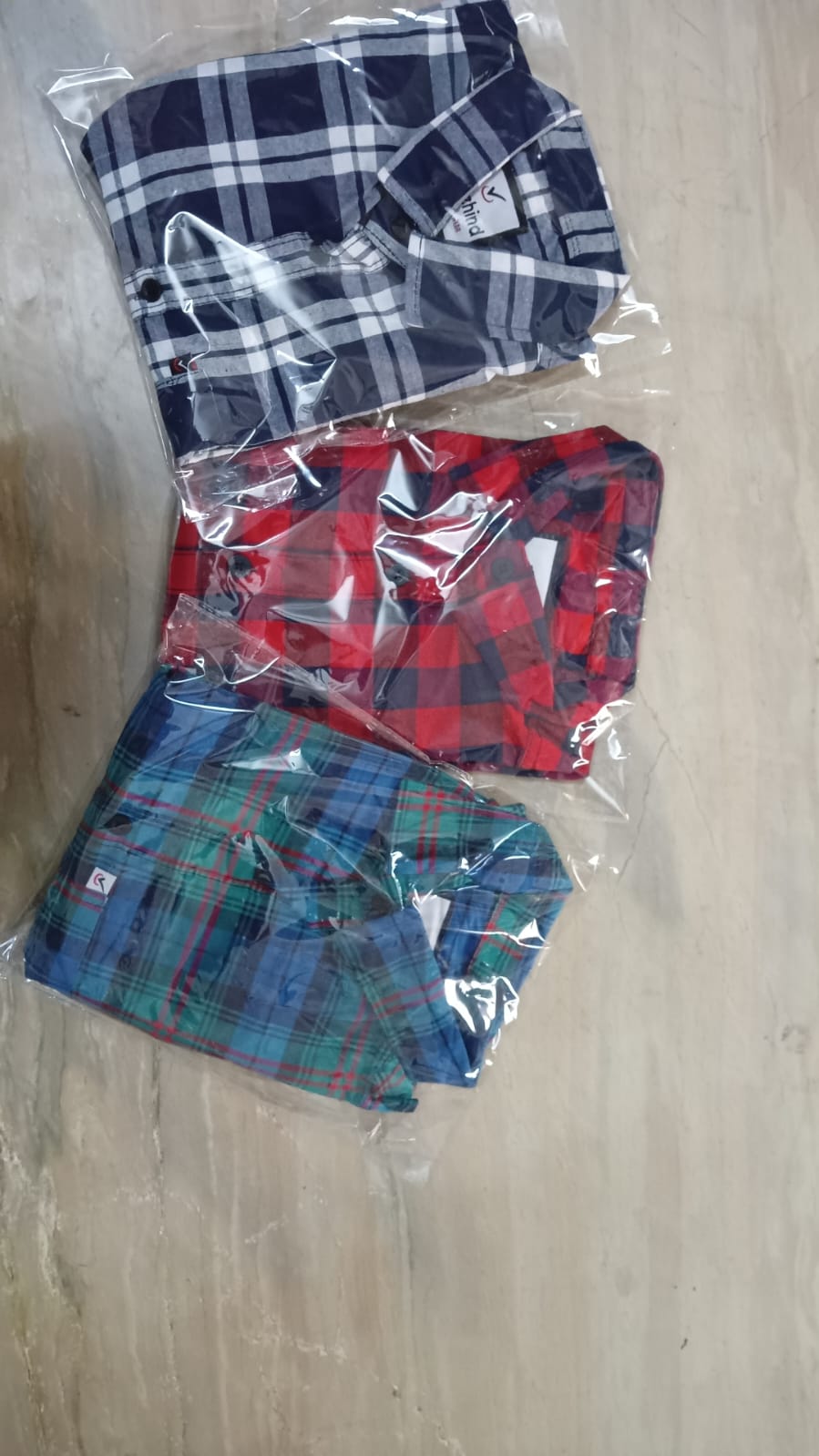 Pack of three multicolor men's shirts by 2527, featuring casual long-sleeve designs and button-up fronts.