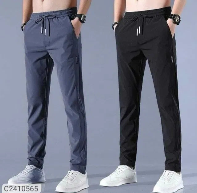 Black and gray men's track pants with high stretch skinny fit made from Lycra, featuring a sleek, athletic design.
