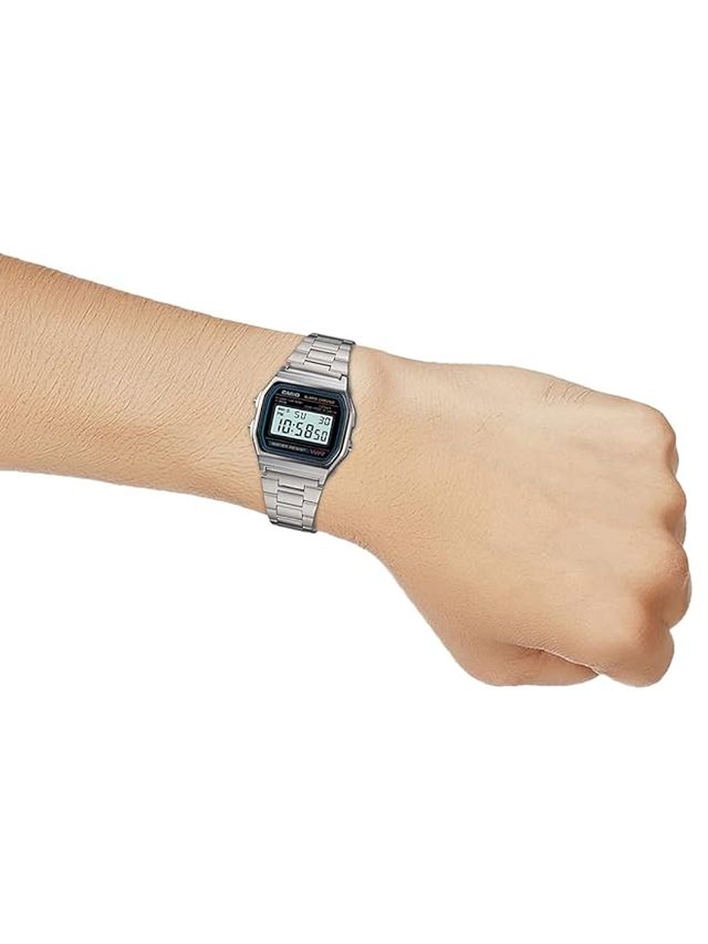 Casio unisex digital watch with black band and digital display, showing time and date on a sleek modern watch face.