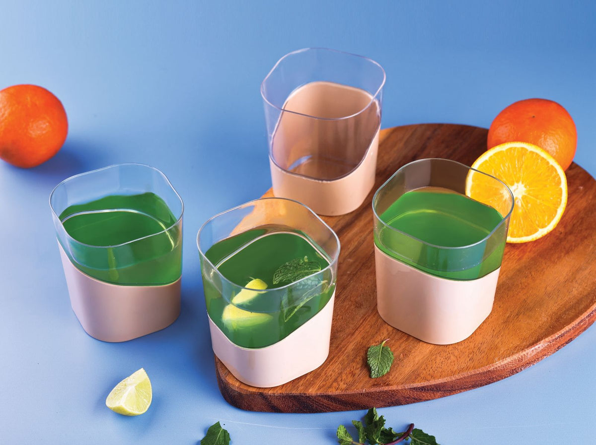 Square plastic water jug with lid and four glass cups, BPA-free food-grade set for water, juice, or wine storage and serving.