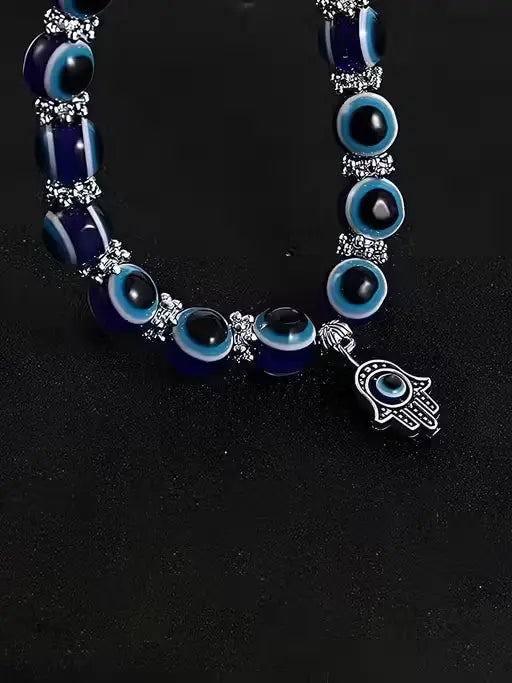 Ekom evil eye adjustable bracelet for women featuring blue and white beads, believed to ward off negative energy.