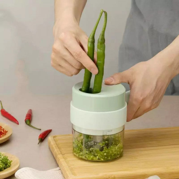 Drpshippr 4-in-1 electric vegetable cutter with blades for slicing, grating, chopping, and dicing in a home kitchen setting.