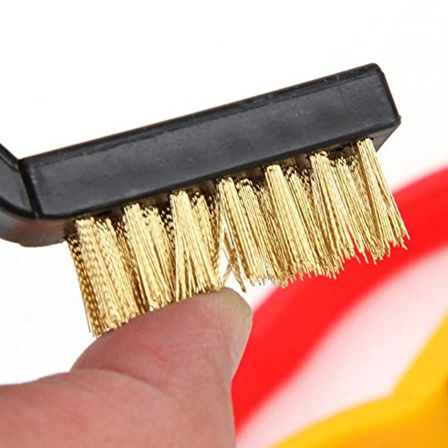 Mini brass wire brush by Wukusy with sturdy bristles, suitable for cleaning and polishing small metal surfaces and tools.