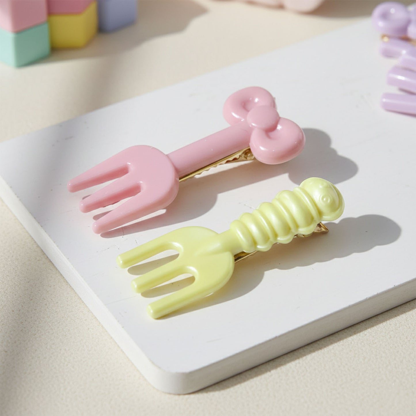 Set of four mini hair clips shaped like forks, featuring cute pink designs from Wukusy, perfect for girls and women.