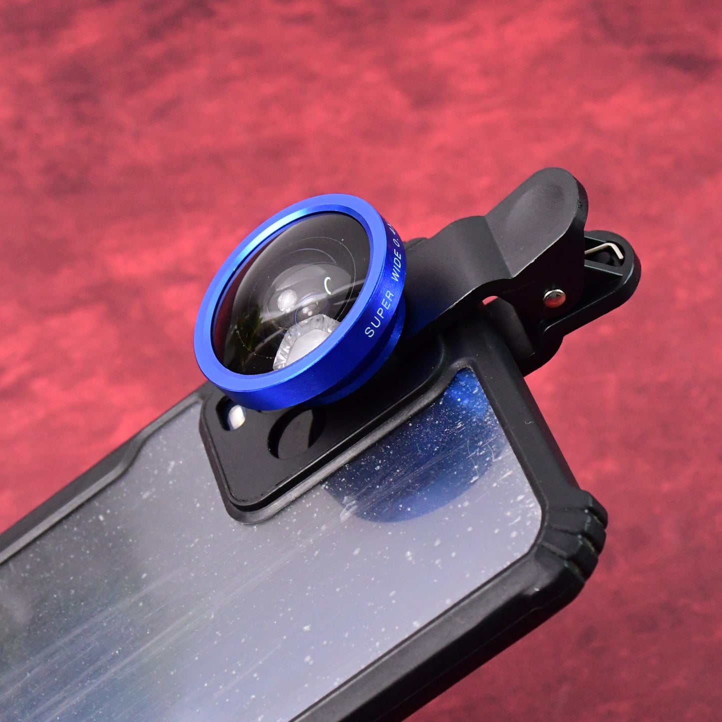 Wukusy universal clip-on selfie camera lens set attached to a smartphone for enhanced photo quality and wide-angle shots.